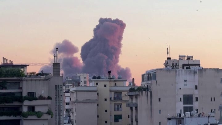 Israeli strike on Hezbollah headquarters in Beirut seen from across city